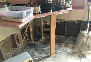 Catholic Charities provided assistance to people who experienced damage to their homes, including cleaning supplies to help with mold removal that affected a kitchen.