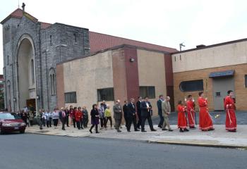 Faithful pray the rosary during the procession in honor of October designated as the month of the rosary. 