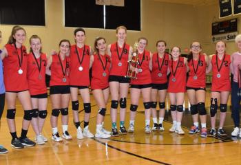 Members from the St. Thomas More volleyball team celebrate their second place finish in the CYO tournament. From left are: Assistant Coach Jenny Kozuch, Olivia East, Alyssa Mullaney, Elizabeth McGorry. Elizabeth Trump, Lauren Trump, Elena Pursell, Kylie Heinze, Isabelle Russo. Molly Maskiell, Diana Grover, Grace Fifield and Coach Jessica Reynolds.