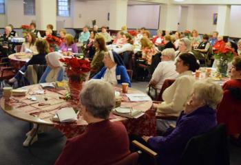 Women listen during a discussion on the Catholic perspective pertaining to the Charles Dickens’ classic “A Christmas Carol.”