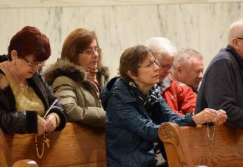 Faithful pray the rosary to begin the evening of worship and music.