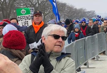 Monsignor Robert Wargo, pastor of St. Joseph the Worker, center, joins the laity in marching for life. (Photo courtesy of Mary Fran Hartigan)