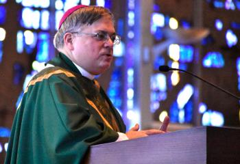 Bishop Alfred Schlert offers the homily during the liturgy. Approximately 25 families attended the reunion, which included the Mass celebrated by Bishop Schlert and a lunch in the parish hall. They attended the Mass along with St. Thomas More parishioners. 