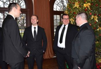 Enjoying the morning are, from left, Matthew Kuna, Aaron Scheidel, Robert Mangan and Father Christopher Butera.