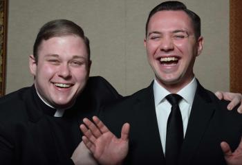 Deacon Zachary Wehr, left, laughs as Philip Maas hams it up for the camera.