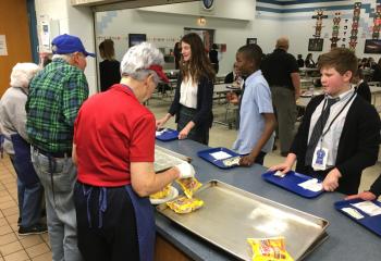 Tony and Theresa Farina serving students.