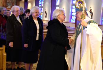 Bishop Schlert greets sisters after the morning liturgy.