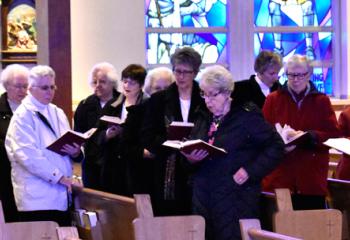 Sisters pray at the beginning of the Mass.