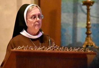 Sister Vincent de Paul serves as lector for the second reading.