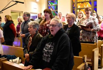 The St. Francis of Assisi Choir sings during the Mass.