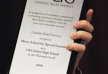 The award presented to Mercy and MHS lauds the students for becoming missionary disciples and living their faith in solidarity with the poor.