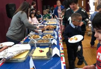 Students and staff from Sacred Heart School (SHS), West Reading celebrate their diversity Jan. 30 by enjoying different ethnic foods during Heritage Food Day. (Photo courtesy of SHS)