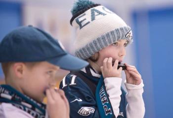 Kaden Gall, left, and Caroline Denzel play the harmonica during the Talent Show at St. Michael the Archangel School (SMAS), Coopersburg. (Photo courtesy of SMAS)