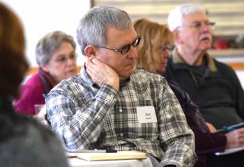 Dan Hudish listens to the presentation.