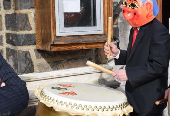A member of the faith beats the drum to call faithful to the procession and Mass in celebration of the Lunar New Year.