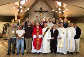 Diocesan priests and a pilgrimage group visit Divina Providencia, where Bishop Oscar Romero was murdered and shot at that altar.