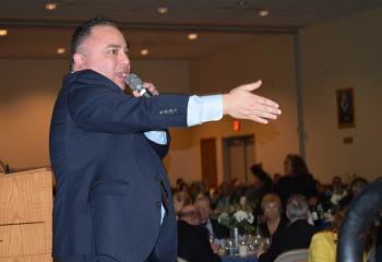 Tony Luna, auctioneer, starts the bidding at the gala. 