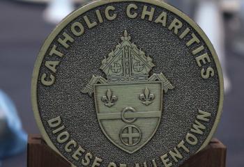 The medallion presented at the Catholic Charities Gala features the coat of arms of the Diocese of Allentown.