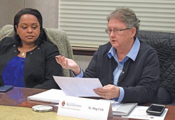 Bernarda Liriano, left, director of the Office of Hispanic Affairs, and Sister Meg Cole, coordinator of the Diocesan Safe Environment Office, share some ideas to better the work of the commission.