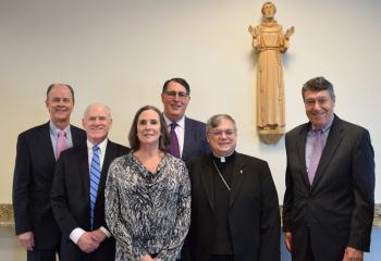 Gathered after the Mass are, from left: Alan Brechbill, executive vice president and COO at Penn State Health; John Morahan; Heidi Masano, vice chair, St. Joseph Regional Health Network (SJRHN) Board of Directors; Mike Duff, member, SJRHN Board of Directors; Bishop Schlert; and Bruce Smith, member, SJRHN Board of Directors. “Even though we are part of Penn State Health, we have retained our Catholic identity...,"said Mike Jupina, vice president of marketing and communications.