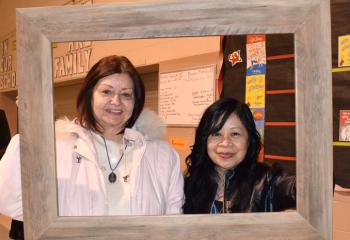 Carol Luckenbill, left, and Annabelle Alegado, parishioners of St. Ignatius, have some photo fun at the BAA reception.