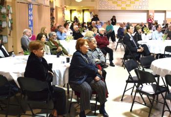 Guests listen to trust advisors speak about the allocation of BAA funds.