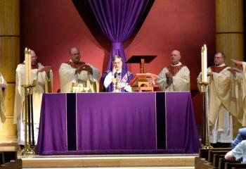 Bishop Alfred Schlert, center, celebrates the Mass with, from left, Msgr. Edward Coyle, Monsignor John Martin, Monsignor Thomas Hoban, Monsignor David James, Father John Pendzick, Monsignor Daniel Yenushosky, Monsignor Francis Schoenauer, Father John Gibbons and Monsignor Gerald Gobitas.