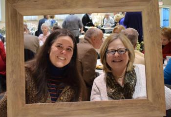 Melissa Starace, left, and her mother, Deborah Starace, parishioners of St. Jane Frances de Chantal, Easton, enjoy the celebration April 1.