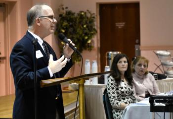 Paul Acampora, secretary of the Diocesan Secretariat for Stewardship and Development, introduces the trust advisors for Northampton County, Sabina Olenchok, center, and Evelyn Carfago.