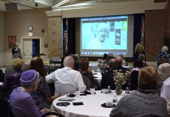 Supporters watch the video highlighting persons, ministries and programs that benefit from BAA.