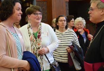 Bishop Schlert, right, greets, from left, Cindy Markoucy and Heather Hamadyk, parishioners of Sacred Heart, Bath.