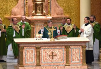 Bishop Alfred Schlert, center, celebrates the Saturday Vigil Mass. With him at the altar are, from left, Father Eugene Ritz, Deacon Isidro Gonzales-Rivera, Deacon Peter Schutzler, Father Adam Sedar, Father Keith Mathur and Father Brendan Laroche.