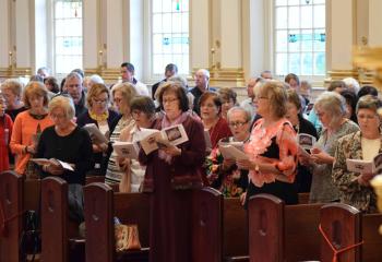 Wives of permanent deacons participate in the liturgy.