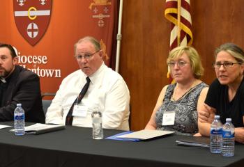 Panelists field questions, from left, Father Adam Sedar, Deacon Rick Lanciano, Kathy Schettini and Dr. Carmina Chapp.