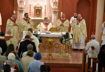 Bishop Schlert, center, celebrates Mass with, from left: Monsignor John Chizmar, pastor of St. Peter the Fisherman, Lake Harmony; Father Adam Sedar, secretary of the Diocesan Secretariat for Clergy; Monsignor William Glosser, pastor of St. Clare; and Monsignor David James, Diocesan vicar general. (Photo by John Simitz)