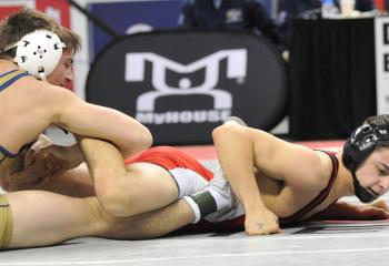 Junior Andrew Cerniglia, left, of Notre Dame dominates Gabe Miller of Pequea Valley 14-0 for a major decision and the Class AA wrestling championship at 145. The Notre Dame champ finished the year at 36-6, while Miller, a senior, pinned Cerniglia in the region finals, lost for the first time this season in 44 bouts. 