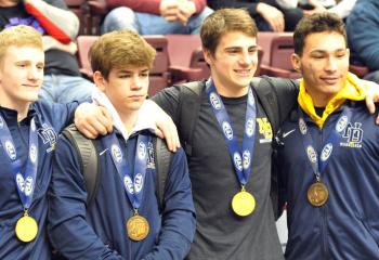 Standing with their PIAA Class AA medals in the Giant Center in Hershey from Notre Dame are, from left: Ryan Crookham, first at 120, Brandan Chletsos sixth at 126, Andrew Cerniglia, first at 145 and Isaiah DeJesus seventh at 170. 