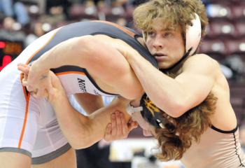Becahi junior Kenny Herrmann, right, looks to take Northampton senior Julian Chlebove to the mat during their PIAA finals showdown in Hershey at 132. Chlebove (44-3) won this brawl 6-2 to win his third Class AAA wrestling championship. Herrmann (30-7) wound up second and became a three-time state place winner after being fourth last year and seventh in 2017.