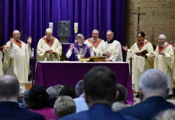 Bishop Alfred Schlert, center, celebrates Mass with, from left, Apostles of Jesus (AJ) Father Barnabas Shayo, Father Ronald Minner, Monsignor William Handges, Monsignor William Glosser, Monsignor Edward Zemanik, Father Eric Tolentino, Father Paul Rothermel and Father Christopher Zelonis.