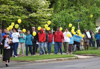 Helen MacMinn, front, chairwoman for the Reading-Berks March for Life, leads an estimated 200 supporters of life in prayer with a megaphone.