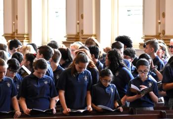 Students from Notre Dame of Bethlehem School participate in the Chrism Mass.(Photo by John Simitz)