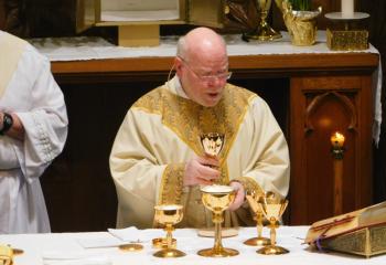 Father William Seifert, administrator of SS. Peter and Paul, Lehighton, celebrates the Mass of the Lord’s Supper on Holy Thursday April 18. “Great care must always be taken to ensure that the celebration of Mass is celebrated in a reverent and devout way, including our preparation and participation at Mass. We must always ensure the dignity of the Holy Eucharist is always maintained,” said Bishop Alfred Schlert. (Photo courtesy of James Logue)