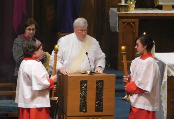 Deacon Joseph Wagner proclaims the Gospel Holy Thursday at SS. Peter and Paul. (Photo courtesy of James Logue)