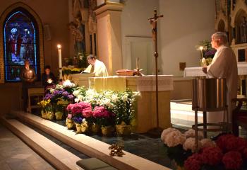 Father Eric Gruber, pastor of St. John Fisher, Catasauqua, proclaims a reading during the Easter Vigil April 20. “Today is our greatest day of rejoicing. Christ has risen from the dead! This day renews our faith and lifts our hearts. We are filled with joy,” said Bishop Alfred Schlert in an Easter message on social media. (Photo by John Simitz)