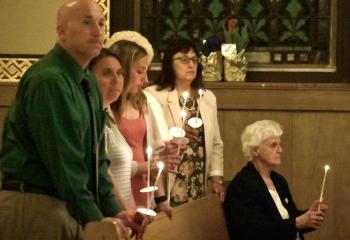 Confirmation candidates attend the Easter Vigil at St. John Fisher, during which they became members of the Church. (Photo by John Simitz)