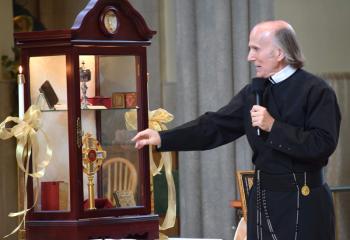 Father Anthony Michalik describes some of St. John Neumann’s relics encased in a reliquary.