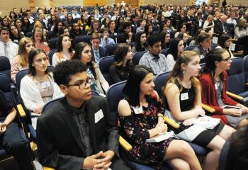 Student scholars and their families listen during the ceremony.