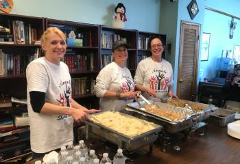 Ladies from Angels Sharing Warmth come to My Father’s House to provide a home cooked meal for the program’s clients and the at-risk community.