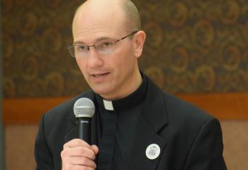 Father Andrew Gehringer addresses those gathered at the Cathedral.