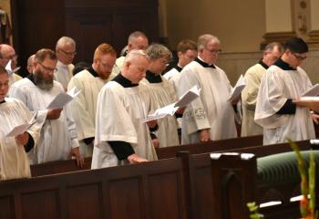 Transitional deacons, deacons and priest pray together during the Holy Hour.
